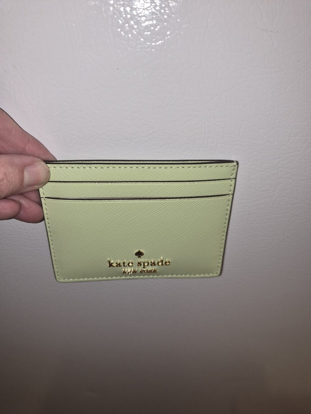 kate spade lemon green card holder with gold logo